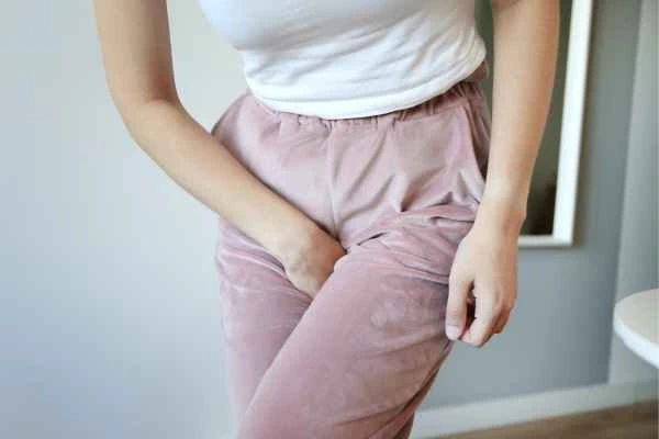 woman running for the toilet because of urinary incontinence Chigwell